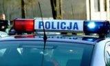 fragment radiowozu z widocznym napisem Policja