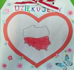 laurka. Czerwone serce wewnątrz kontury Polski pomalowane na biało-czerwono.